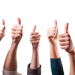 multiple people holding their thumbs up