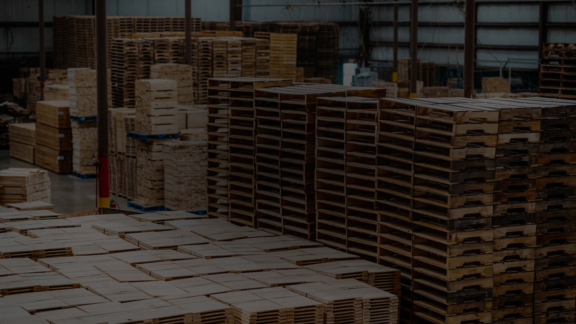 warehouse full of pallets with dark overlay