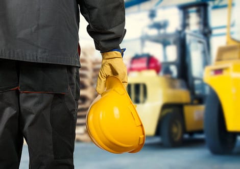gentleman wearing his safety helmet in warehouse