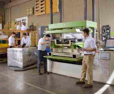 students with professor in the packaging area