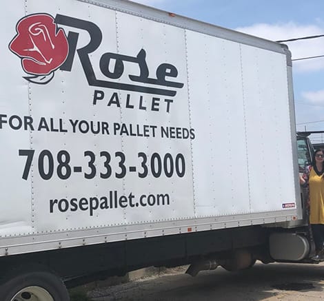 side view of semi truck with rose pallet branding