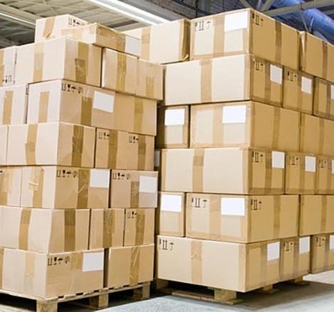 a lot of boxes stacked on wooden pallets