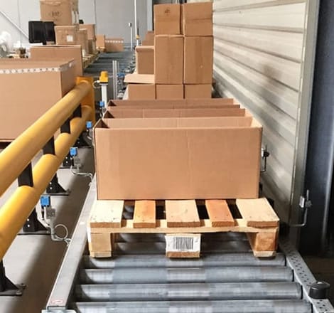 boxes sitting on wooden pallets