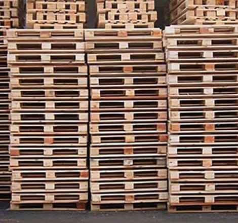 multiple wooden pallets piled up