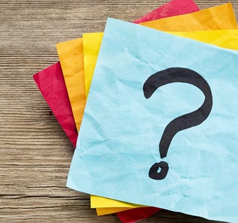 multiple sticky notes with question mark in the middle
