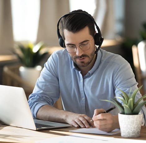 gentleman taking online classes on computer