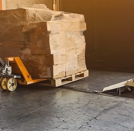 gentleman moving pallets on jack