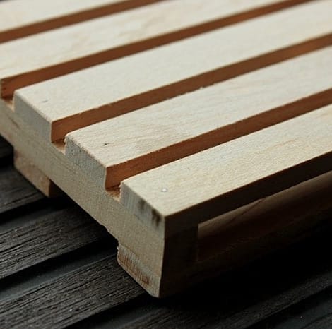 new pallet on top of stained dark pallet