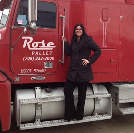amy standing on rose pallet semi truck