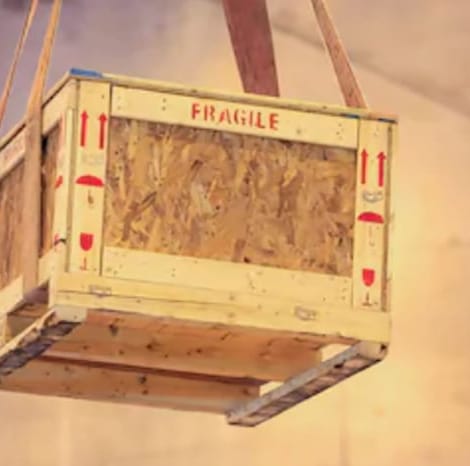 wooden pallet box being carried in warehouse