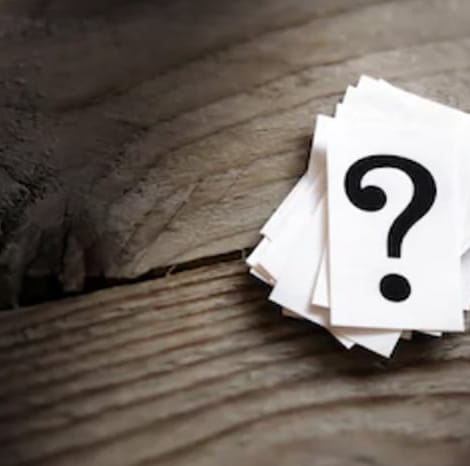 question marks on piece of paper
