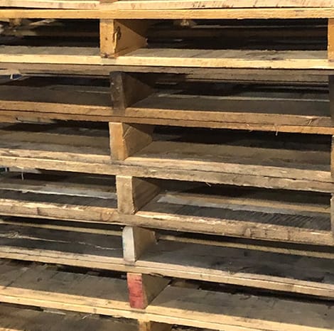 wooden pallets stacked up