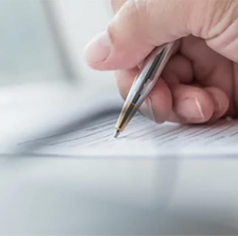 close-up of gentleman writing on form