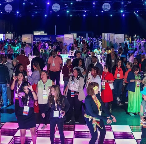 group of people dancing on the dance floor