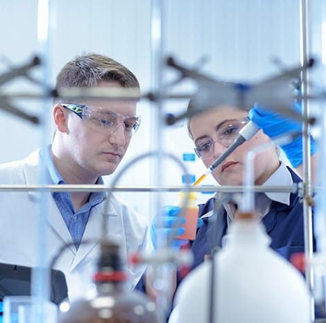 two chemists doing experiment