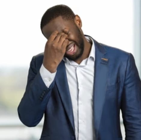 gentleman holding head