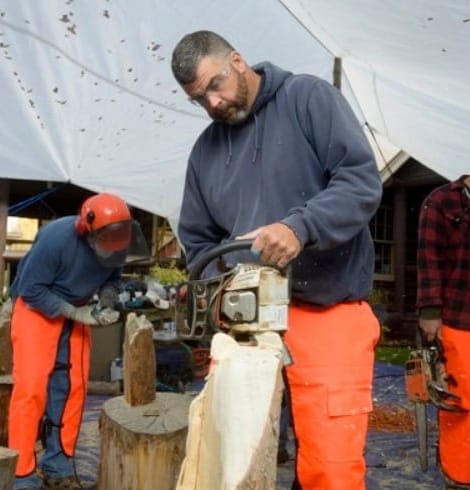 gentleman carving food with saw