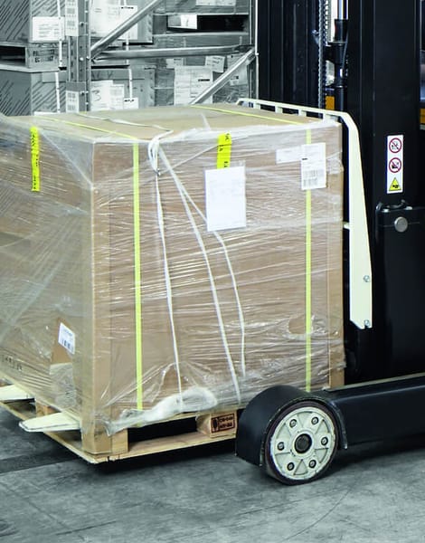 gentleman using forklift to move pallets around