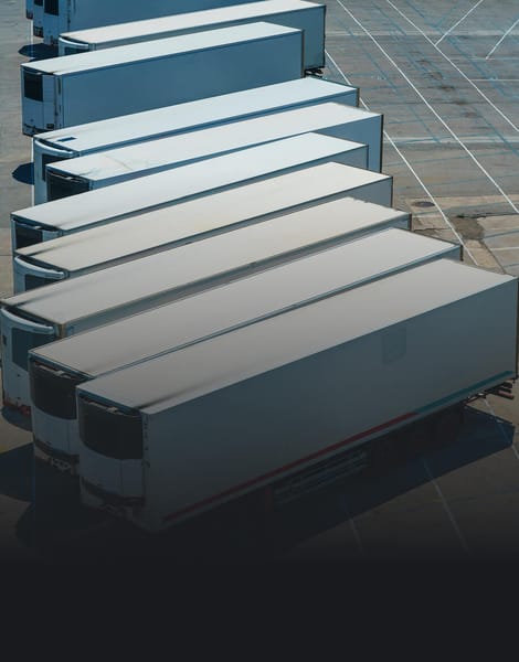 multiple trailers lined up in parking lot