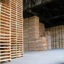 stacks of pallets in warehouse
