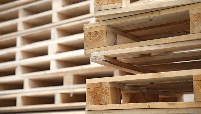 close-up of stacked recycled pallets